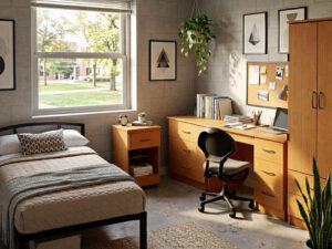 Student dorm with Camden metal bed and Merit laminate casegoods from Sauder Education