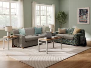 Student Suite or Apartment on Campus with Comfortable Couch and Chair with Metal Leg and Laminate Top Coffee Table and End Tables.