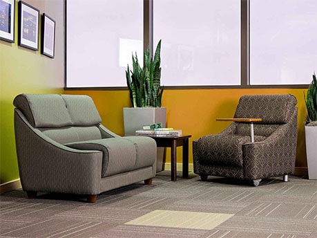 Cavetto Loveseat and Cavetto Chair with Tablet Arm in Lounge Area on Campus