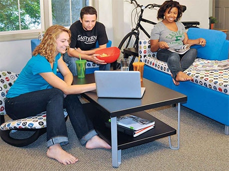 Students in Dorm Room Studying and Relaxing class=