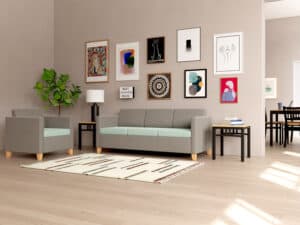 Res Hall Room with Sofa and Loveseat with end tables and a dining area in the background