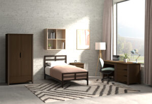 Student dorm room with metal bed and laminate casegoods.